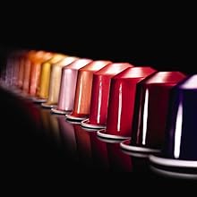 image shows multiple colours of nespresso capsules